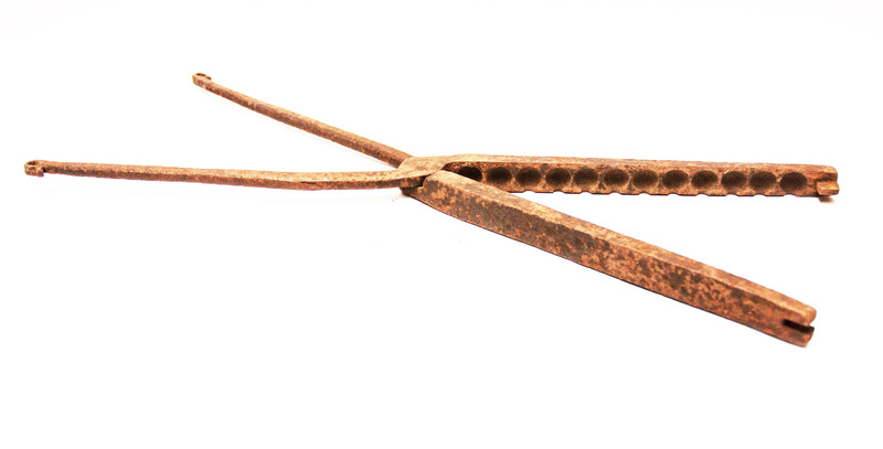 A rare 17th century iron plier for making lead bullets.