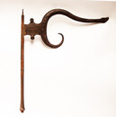 A rare eighteenth century iron apothecary shop sign with a snake head.
