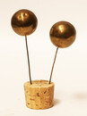 A set of brass head decorations from the traditional catholic dress of Zuid-Beveland. 