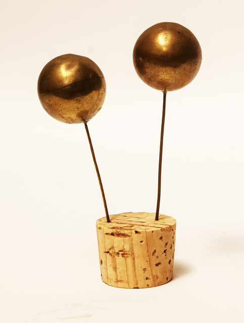 A set of brass head decorations from the traditional catholic dress of Zuid-Beveland. 