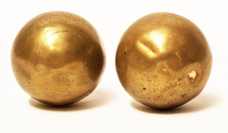 A set of brass head decorations from the traditional catholic dress of Zuid-Beveland. 