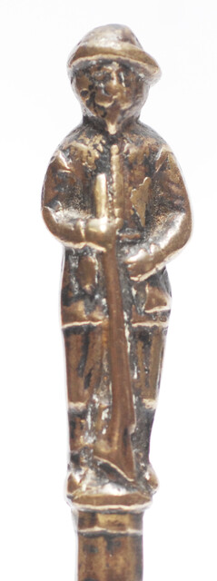 A seventeenth century Dutch knife with a brass handle showing a hunter and his dog.
