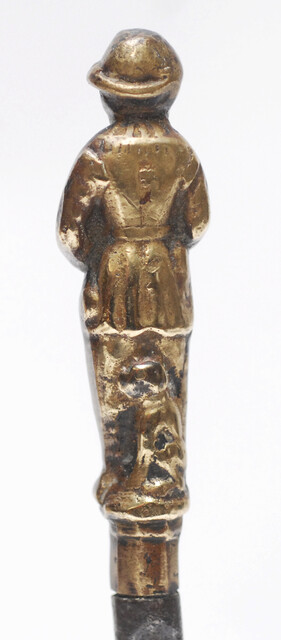 A seventeenth century Dutch knife with a brass handle showing a hunter and his dog.