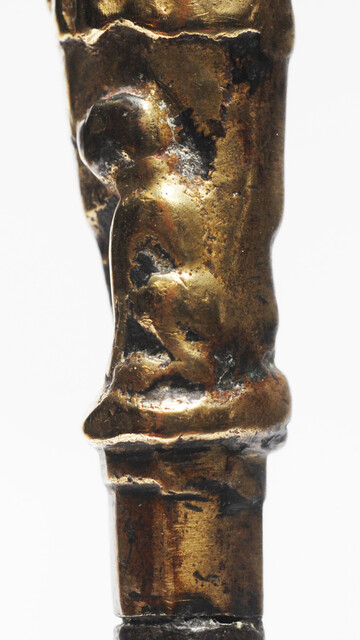 A seventeenth century Dutch knife with a brass handle showing a hunter and his dog.