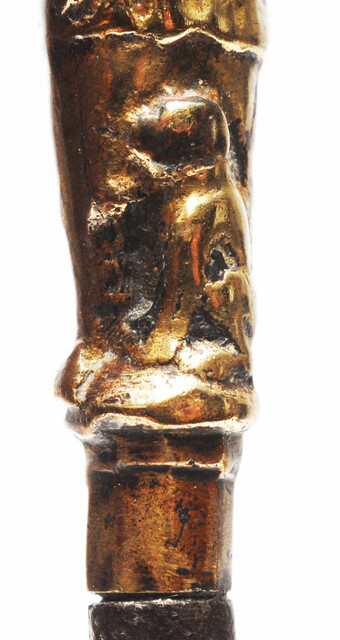A seventeenth century Dutch knife with a brass handle showing a hunter and his dog.