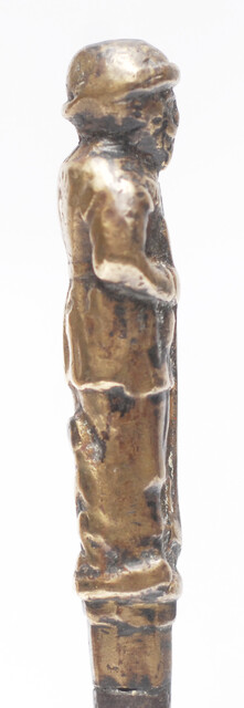 A seventeenth century Dutch knife with a brass handle showing a hunter and his dog.