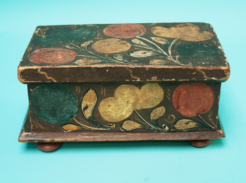 A  small 18th C. Southern German pinewood box decorated with flowers. 