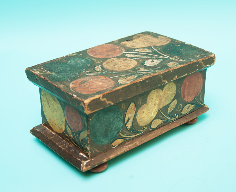 A  small 18th C. Southern German pinewood box decorated with flowers. 