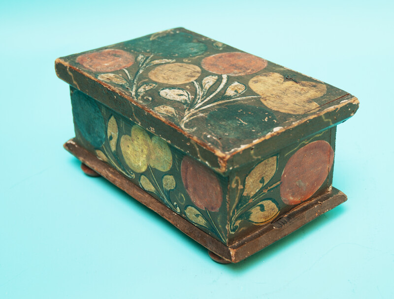 A  small 18th C. Southern German pinewood box decorated with flowers. 