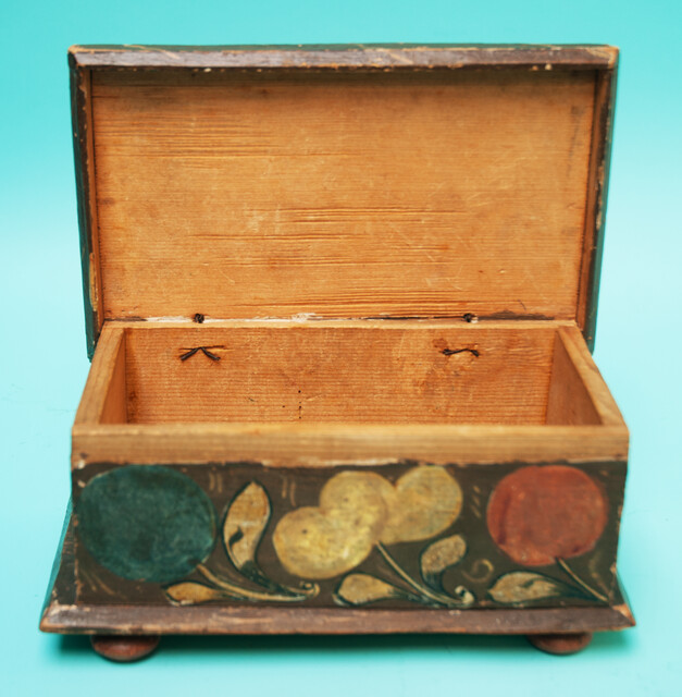 A  small 18th C. Southern German pinewood box decorated with flowers. 