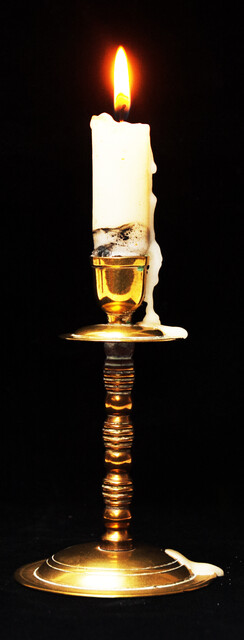 A small brass travel candle stick.