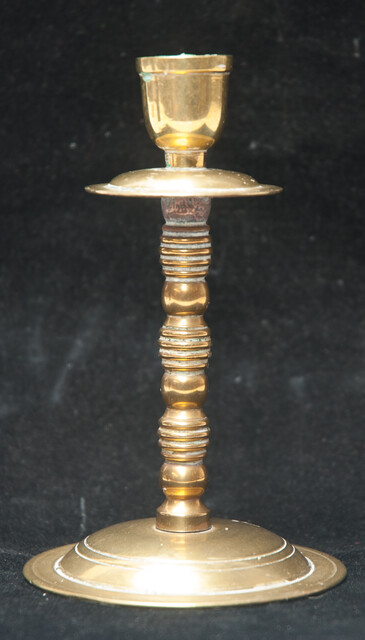 A small brass travel candle stick.