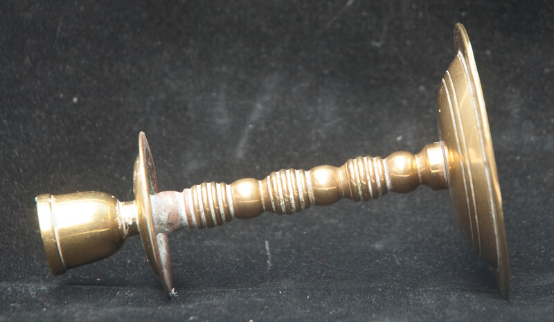 A small brass travel candle stick.