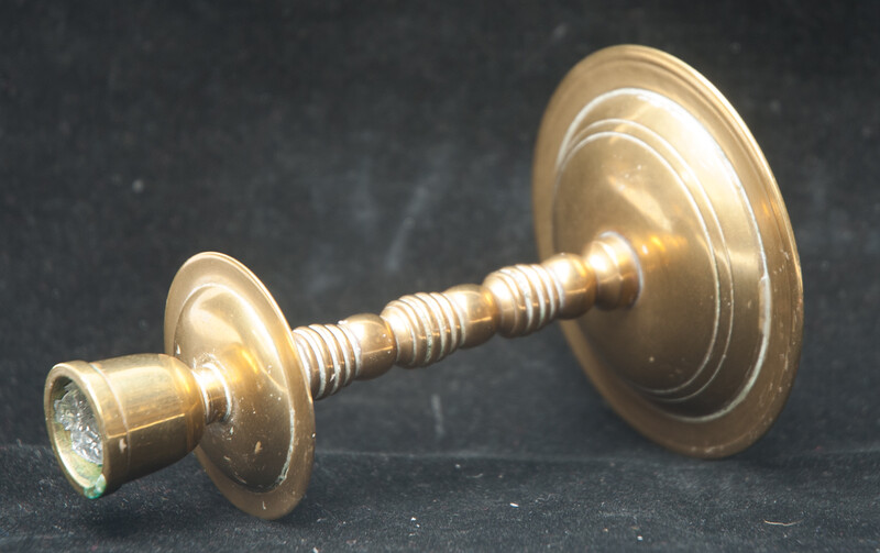 A small brass travel candle stick.