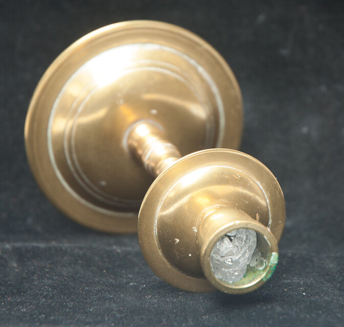 A small brass travel candle stick.