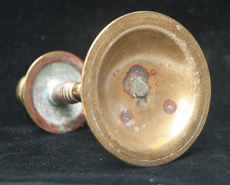 A small brass travel candle stick.