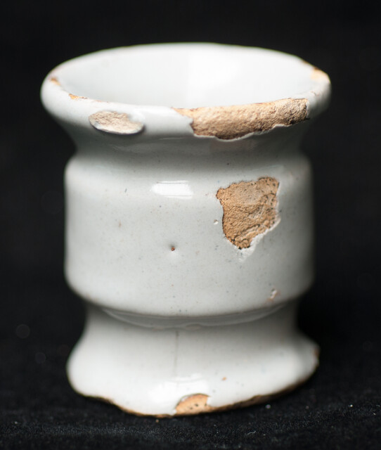 A small rare and early 17th C. Delft white albarello type ointment jar.