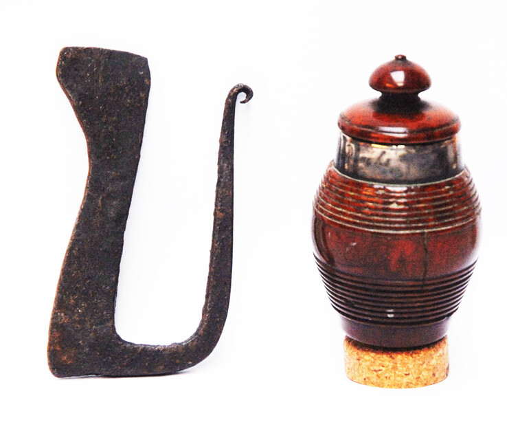 A tinderbox made from coquilla nut. With a contemporary firing iron. 