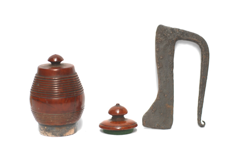 A tinderbox made from coquilla nut. With a contemporary firing iron. 