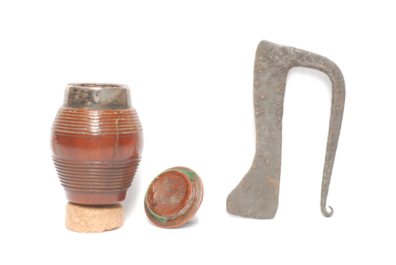 A tinderbox made from coquilla nut. With a contemporary firing iron. 