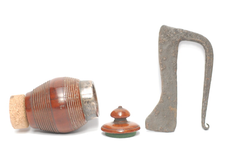 A tinderbox made from coquilla nut. With a contemporary firing iron. 