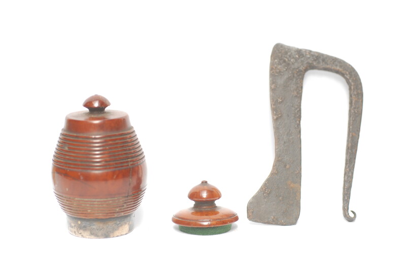 A tinderbox made from coquilla nut. With a contemporary firing iron. 