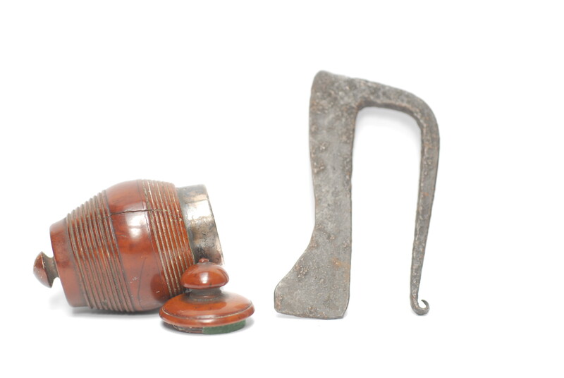 A tinderbox made from coquilla nut. With a contemporary firing iron. 