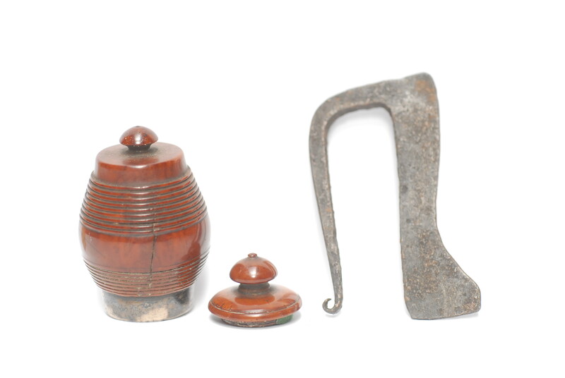 A tinderbox made from coquilla nut. With a contemporary firing iron. 