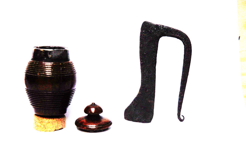 A tinderbox made from coquilla nut. With a contemporary firing iron. 