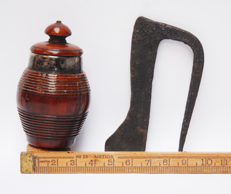 A tinderbox made from coquilla nut. With a contemporary firing iron. 