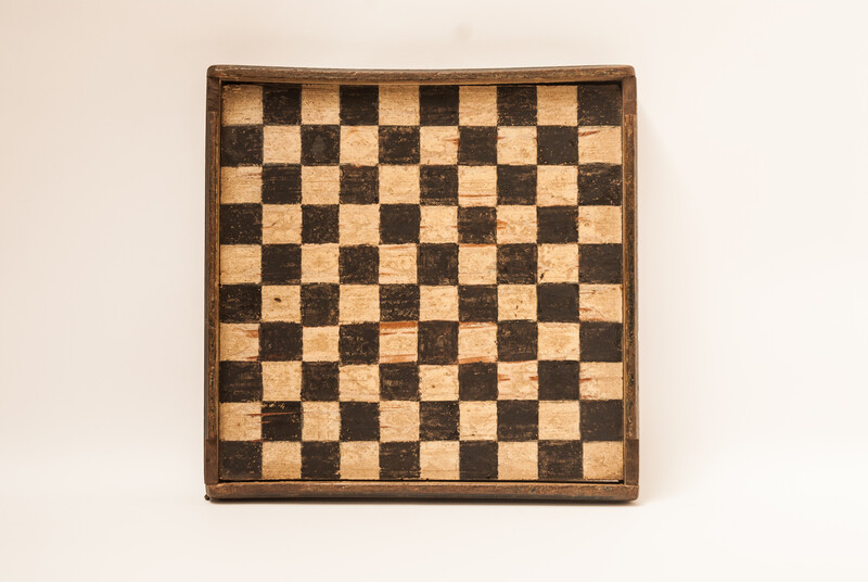 A unique Dutch painted draughtboard and a Fox and Geese game dated 1754, with a complete set of draughts in a fitted box.