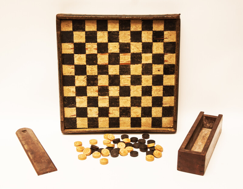 A unique Dutch painted draughtboard and a Fox and Geese game dated 1754, with a complete set of draughts in a fitted box.