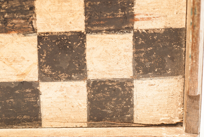A unique Dutch painted draughtboard and a Fox and Geese game dated 1754, with a complete set of draughts in a fitted box.