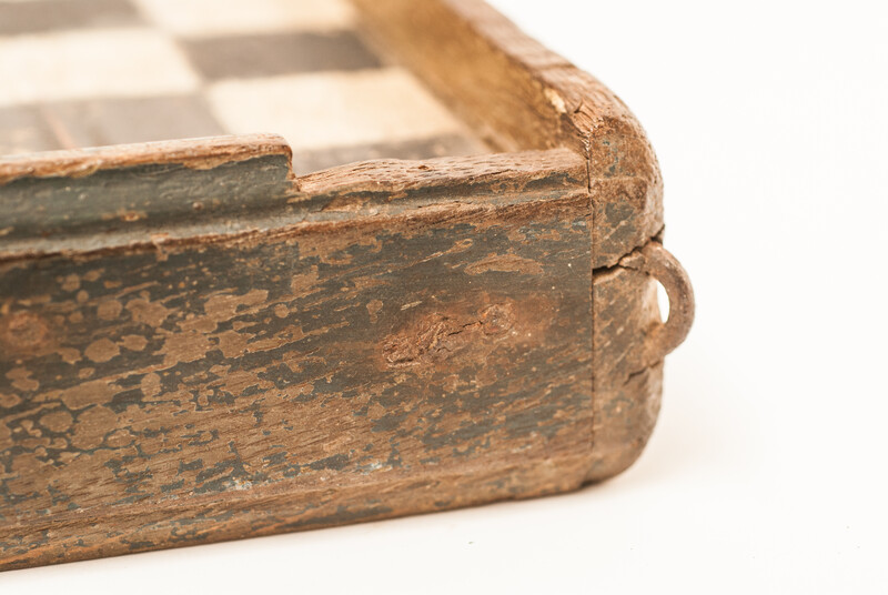 A unique Dutch painted draughtboard and a Fox and Geese game dated 1754, with a complete set of draughts in a fitted box.