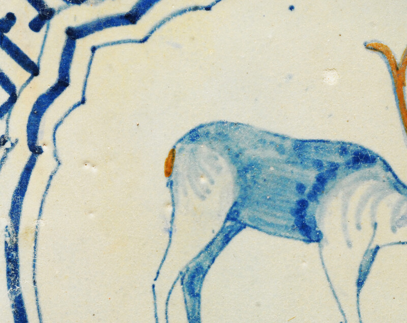 A very rare polychrome early seventeenth century Delft tile with a hart.