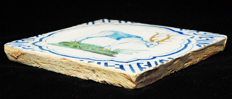 A very rare polychrome early seventeenth century Delft tile with a hart.