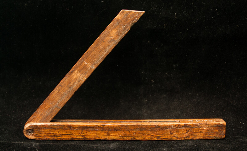 A wooden Dutch carpenters bevel dated 