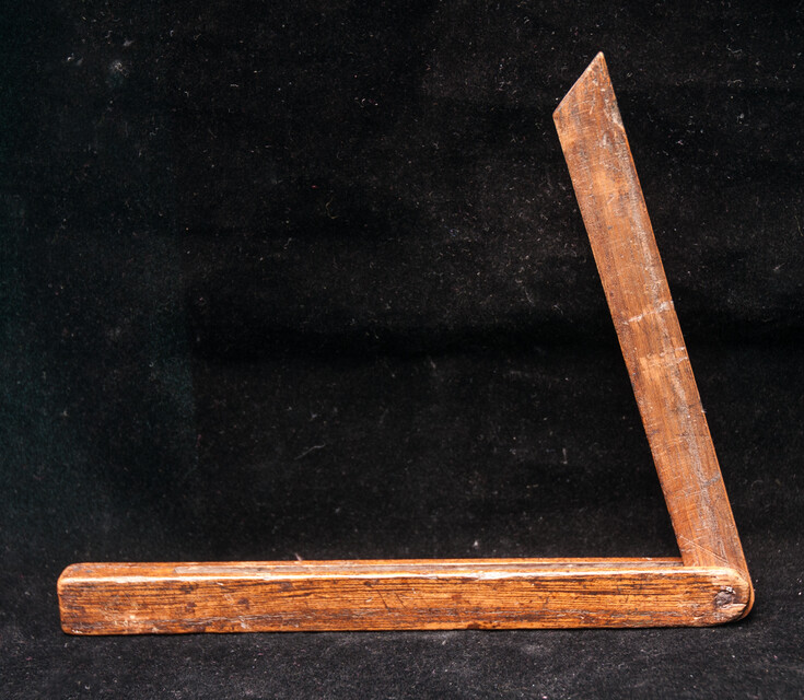 A wooden Dutch carpenters bevel dated 