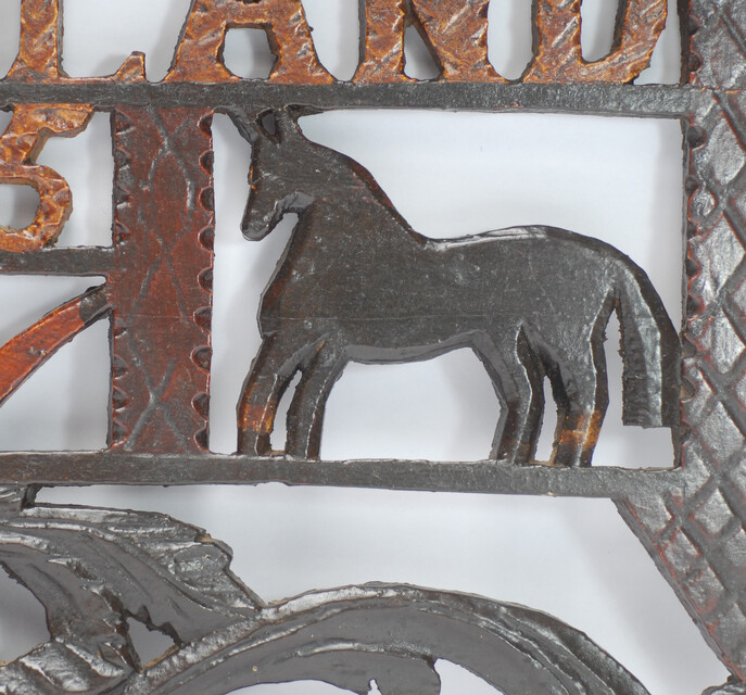 A wooden painted piperack dated 1865.