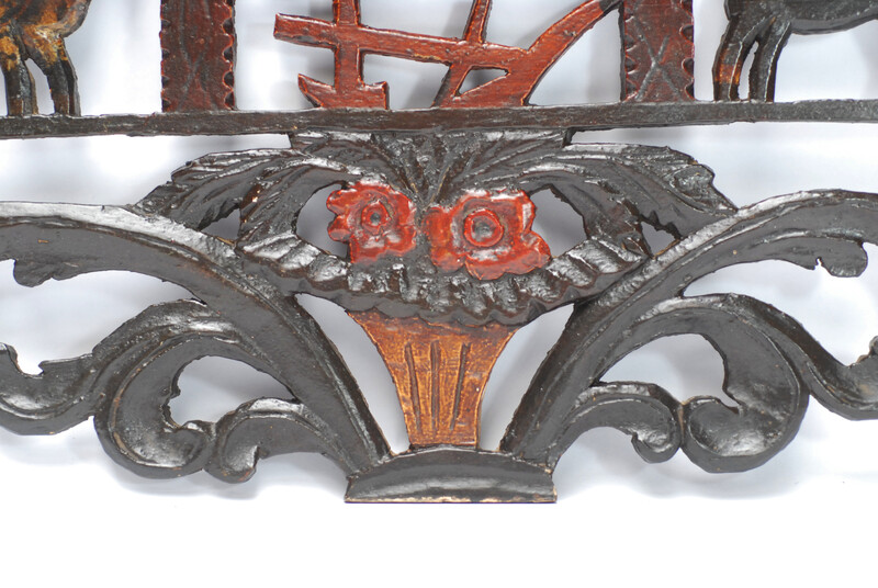 A wooden painted piperack dated 1865.