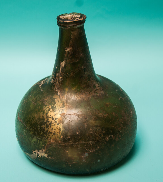 An 18th C. Dutch beautifully iridescent wine bottle from a shipwreck. 