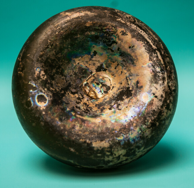 An 18th C. Dutch beautifully iridescent wine bottle from a shipwreck. 