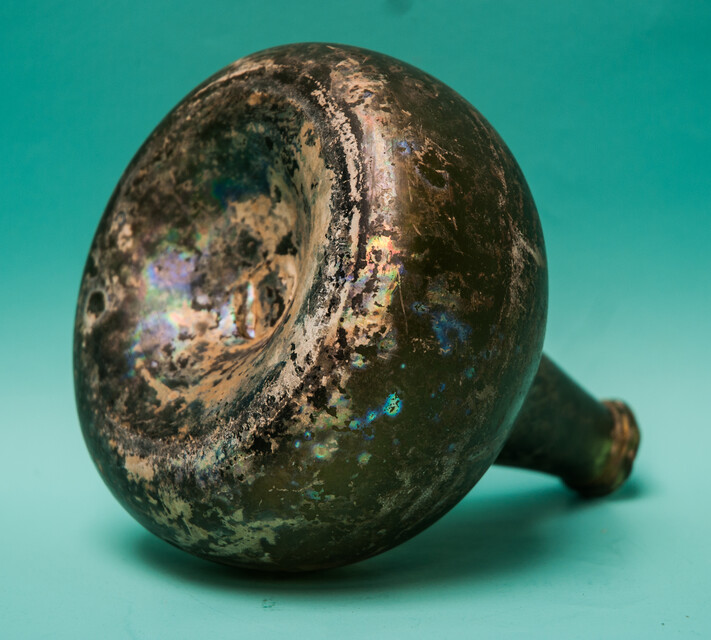 An 18th C. Dutch beautifully iridescent wine bottle from a shipwreck. 