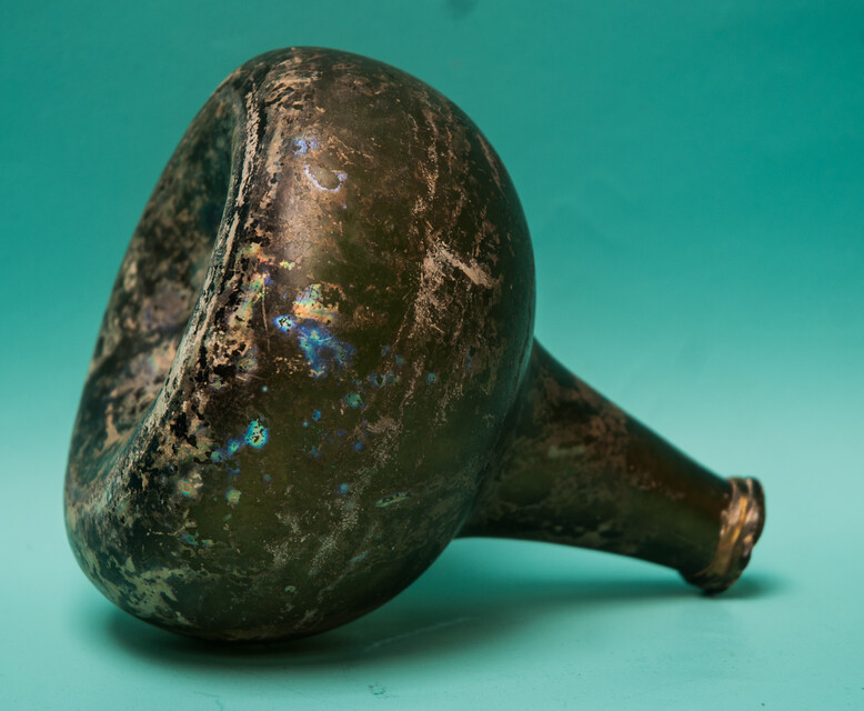 An 18th C. Dutch beautifully iridescent wine bottle from a shipwreck. 