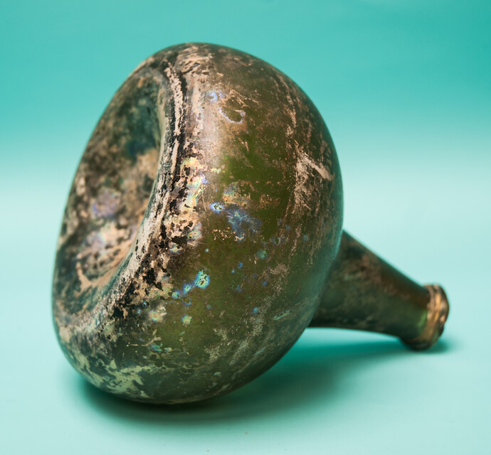 An 18th C. Dutch beautifully iridescent wine bottle from a shipwreck. 