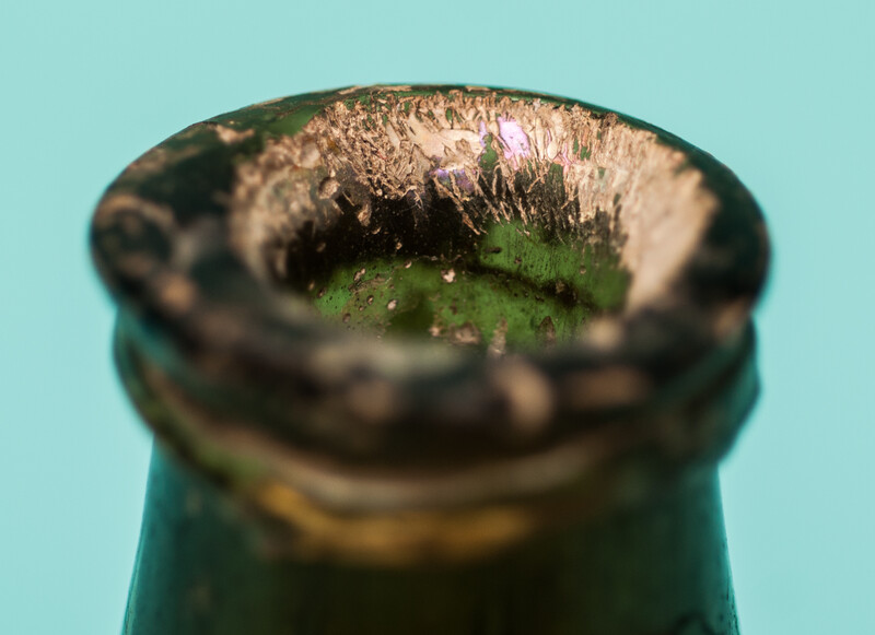 An 18th C. Dutch beautifully iridescent wine bottle from a shipwreck. 