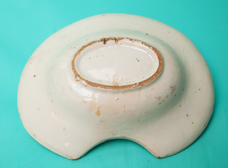 An 18th C earthenware shaving bowl made in Nevers.