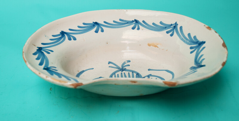 An 18th C earthenware shaving bowl made in Nevers.