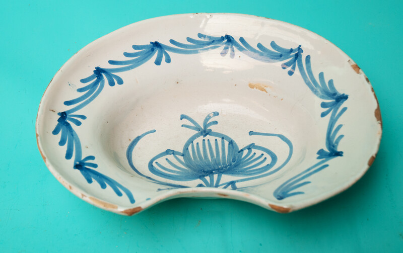 An 18th C earthenware shaving bowl made in Nevers.