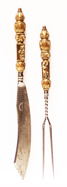 An 18th C. elegant brass set of knife and fork with inlay of mother of pearl. The knife signed 